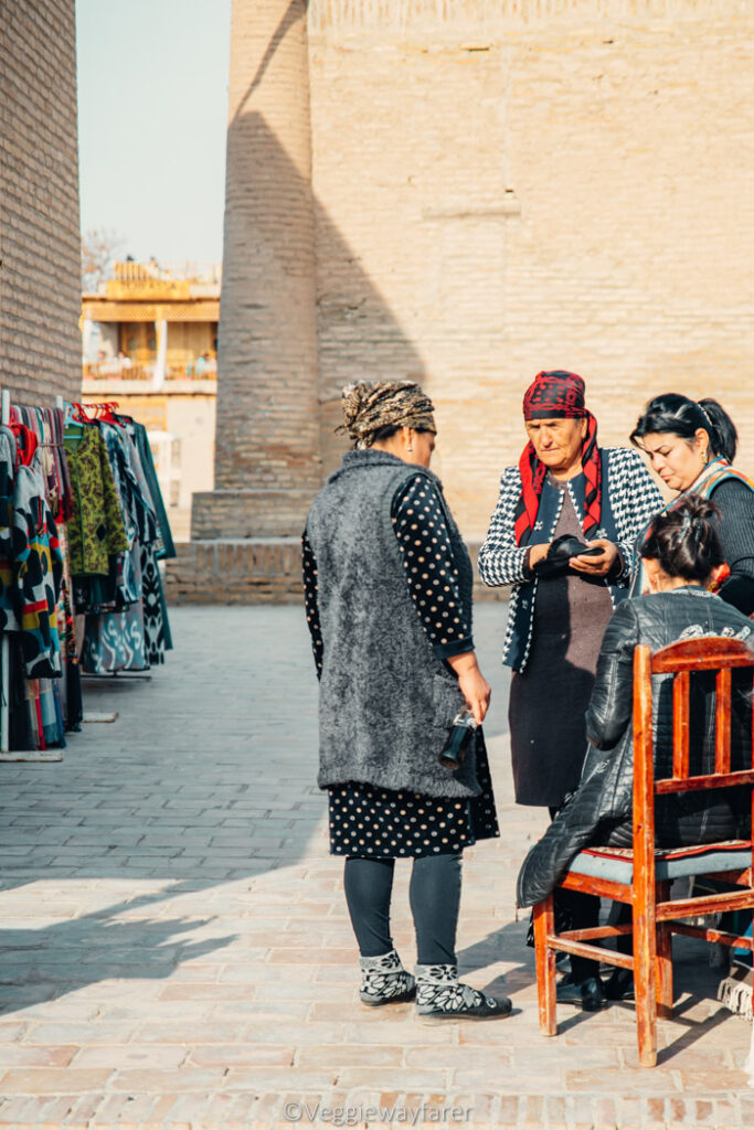 people bartering Shopping in Khiva Uzbekistan
