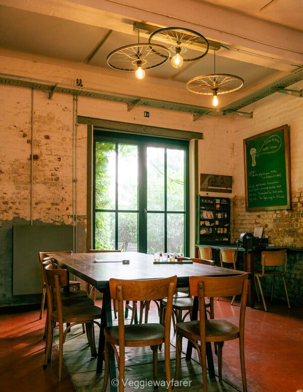 Bicycle wheels hung as light fittings in the tasting room at Brouwerij de Coureur in Kessel-Lo