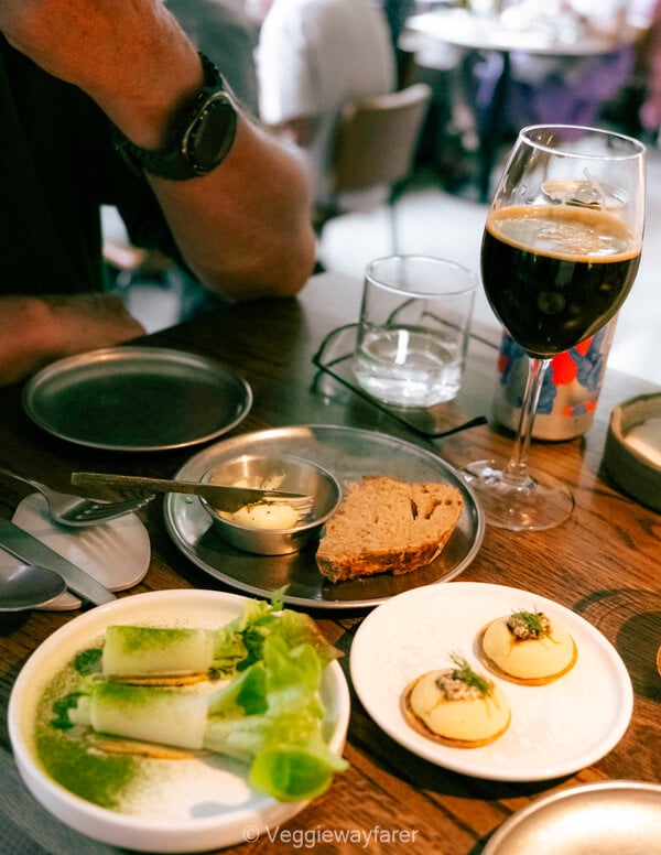Hop Gastropub with beer and bread and little dishes of food