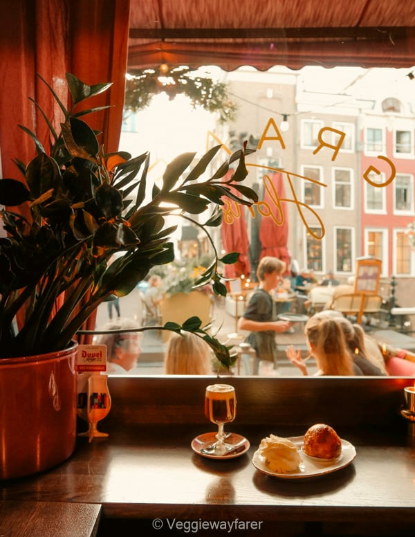 Irish coffee and pastry in a bar overlooking de Vismarkt in Utrecht Netherlands