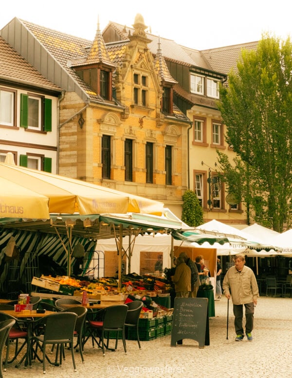 Market stalls surrounded by historic buildings in Bretten