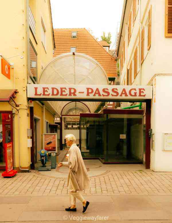 Lady walking by the Leder Passage in Calw Germany