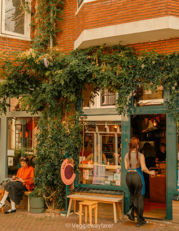 little coffee and pastry shop in Utrecht with people coming in and out.
